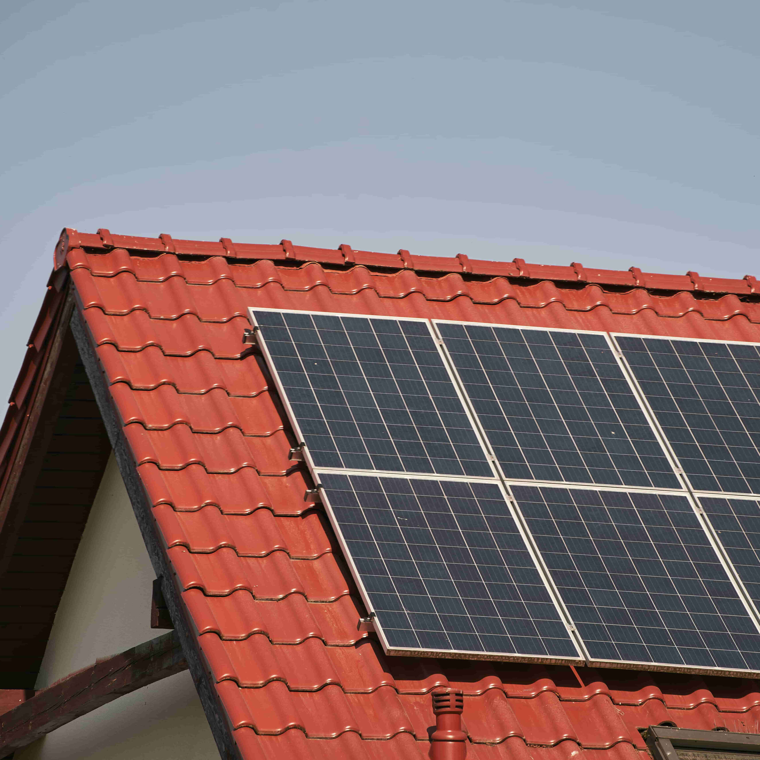 Red roof with solar panel it concept environmental conservation sustainable energy sources (2)